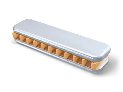 Diatonic harmonica lying flat with a honey wood comb, brass reed plates and rounded silver cover plates