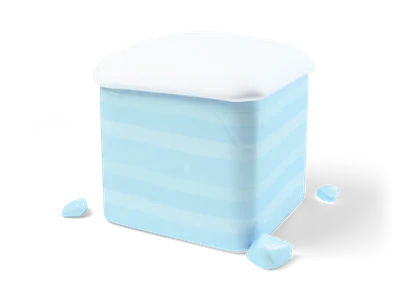 Light blue ice cube with soft rounded edges, a thick white snow layer on top and small ice chips