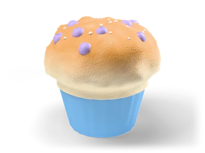 Blueberry muffin with a golden domed top over a pleated sky blue paper liner