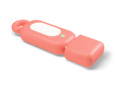 Coral USB flash drive with cream grip pad, small green light, key ring eyelet and a matching coral cap